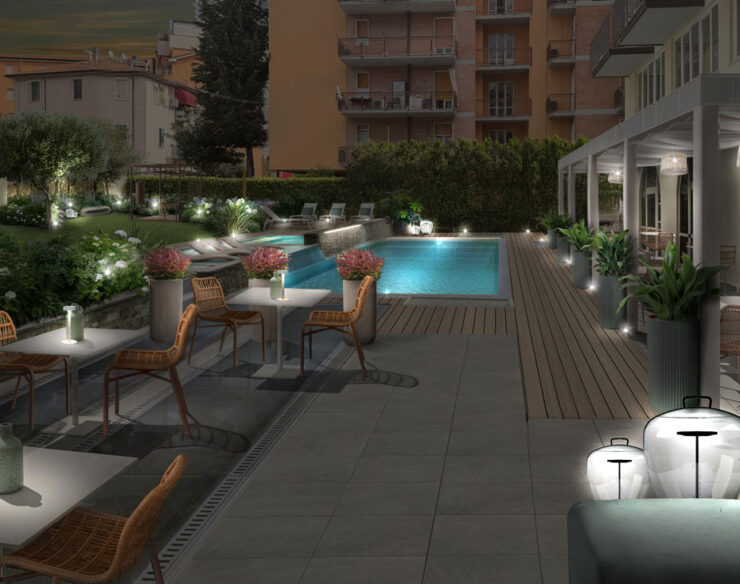 Giardino di hotel a Verona illuminato di sera con piscina e aree relax